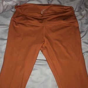 Size large, rustic orange Nike dri-fit leggings